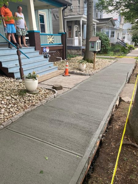 Our walkway paving team working in Amityville