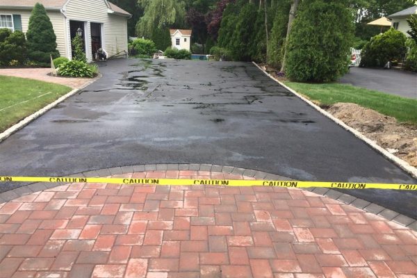 Our asphalt pavers working in Lindenhurst