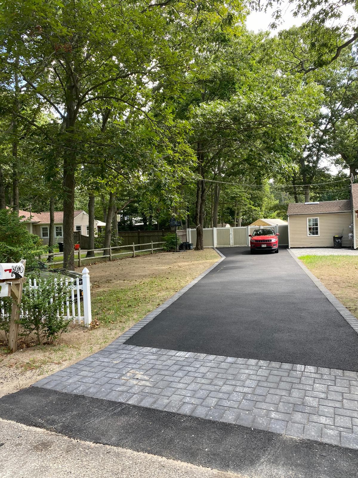 Our asphalt pavers working in Smithtown