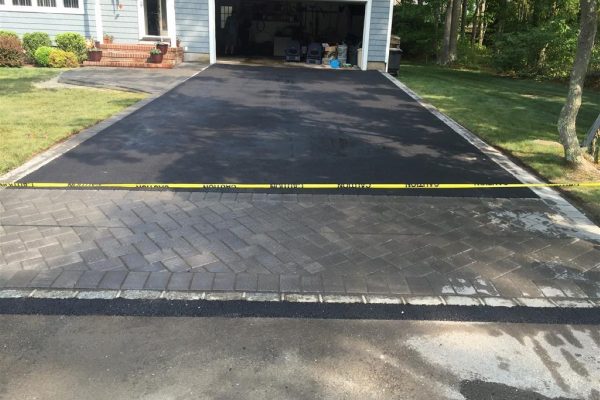 Our asphalt pavers working in West Babylon